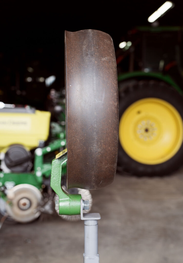 Close-up of the 4AG gauge wheel showcasing its durable design and high-quality composition, built for long-lasting performance in farming operations.