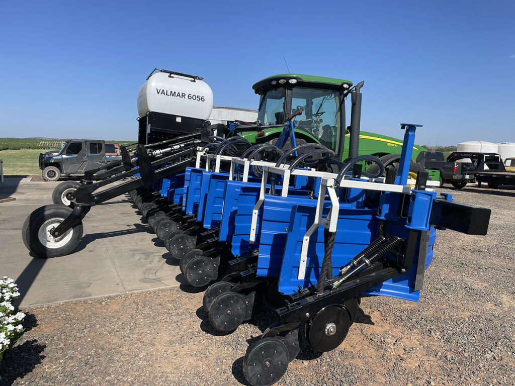 4AG interseeder in action, planting cover crops over existing crops with a tractor, designed to improve soil health and maximize crop yield.