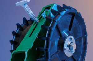 Close-up of 4Ag closing wheel from a low side angle highlighting axle and wheel