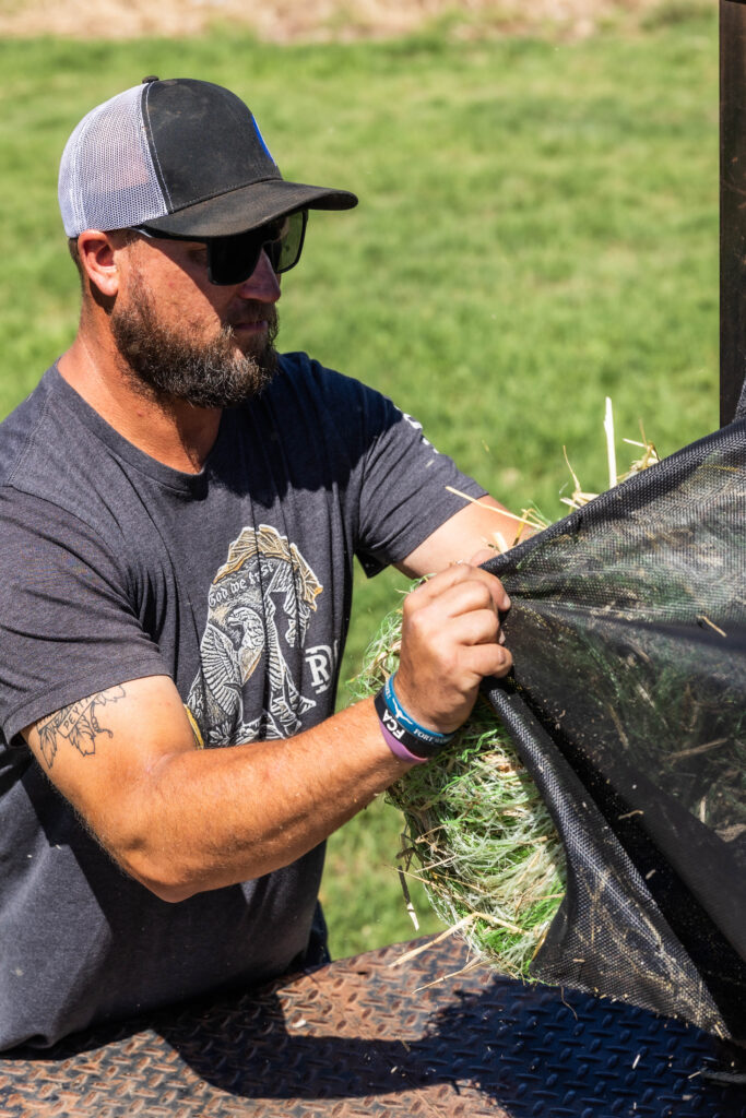 Rancher Using Truck Bed Net Wrap Organizer | 4AG Catch All