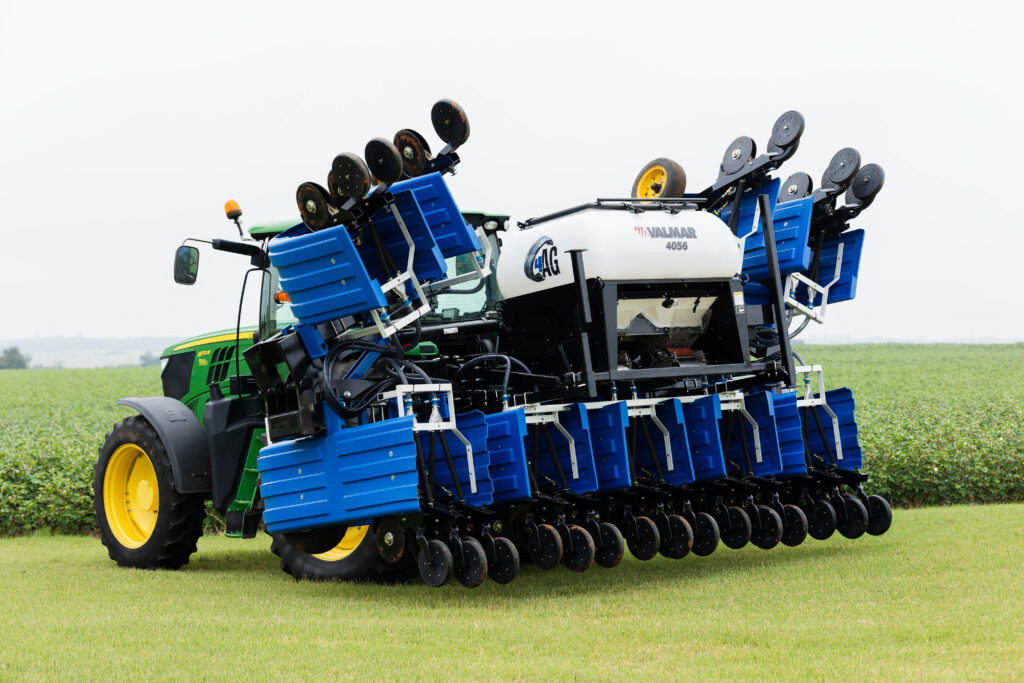 4AG seeder machine and no-till seed drill folded for transport on tractor.