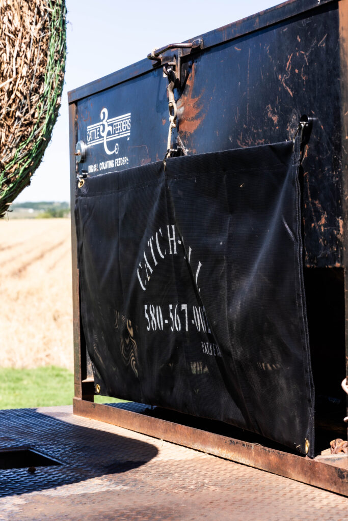 Catch All net sack installed on flatbed cake feeder to hold hay bale netting and feed bag waste