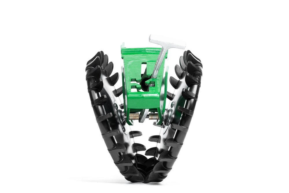 Close-up view of planter closing wheels for no till planting, part of modern farming equipment ensuring seed-to-soil contact.