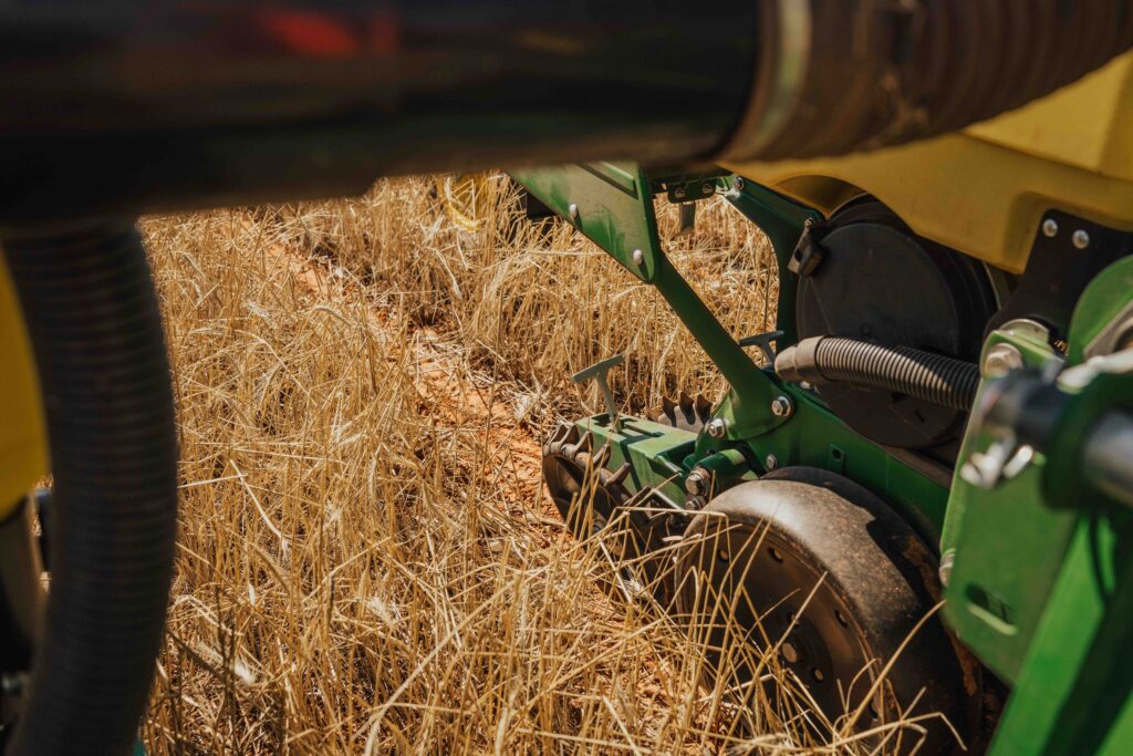 Planter gauge wheels operating in no till planting with farming implements designed for consistent depth control