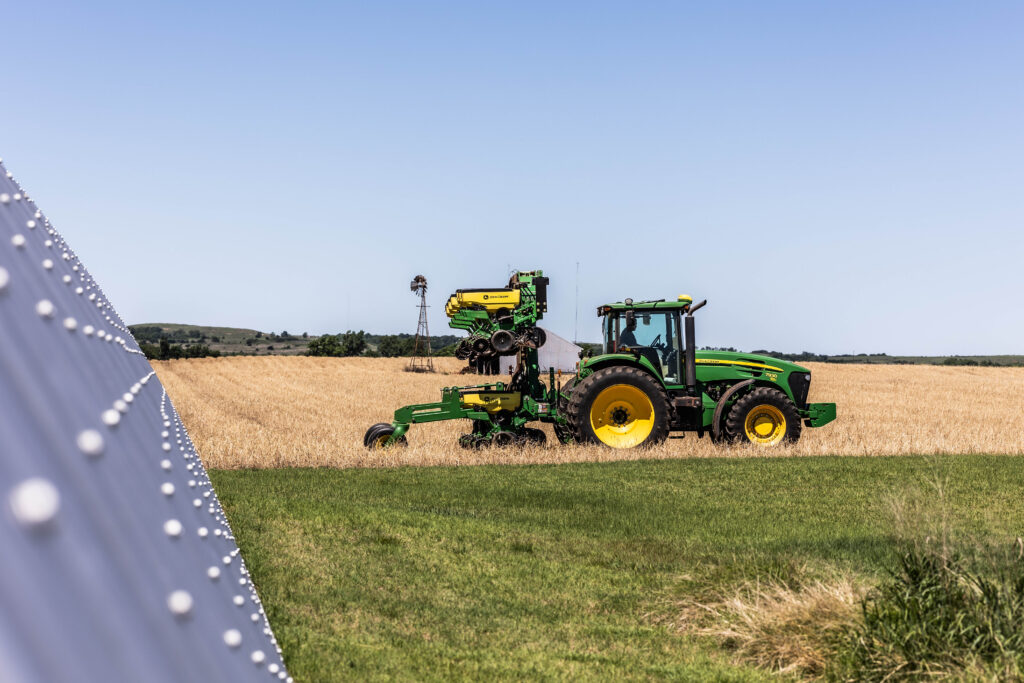 John Deere tractor and planter working in an Oklahoma agriculture field, demonstrating modern equipment used by an Oklahoma farmer for efficient crop production.