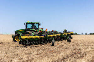 Planter closing wheels on a no till planter working in a field, supporting consistent seed placement and emergence during no till farming.